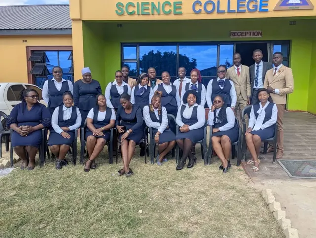 A school group outside Successvale Science College reception